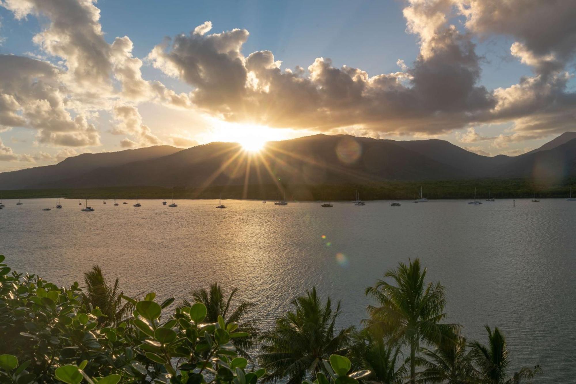 Hilton Cairns Hotel Exterior photo Sunset over the lagoon