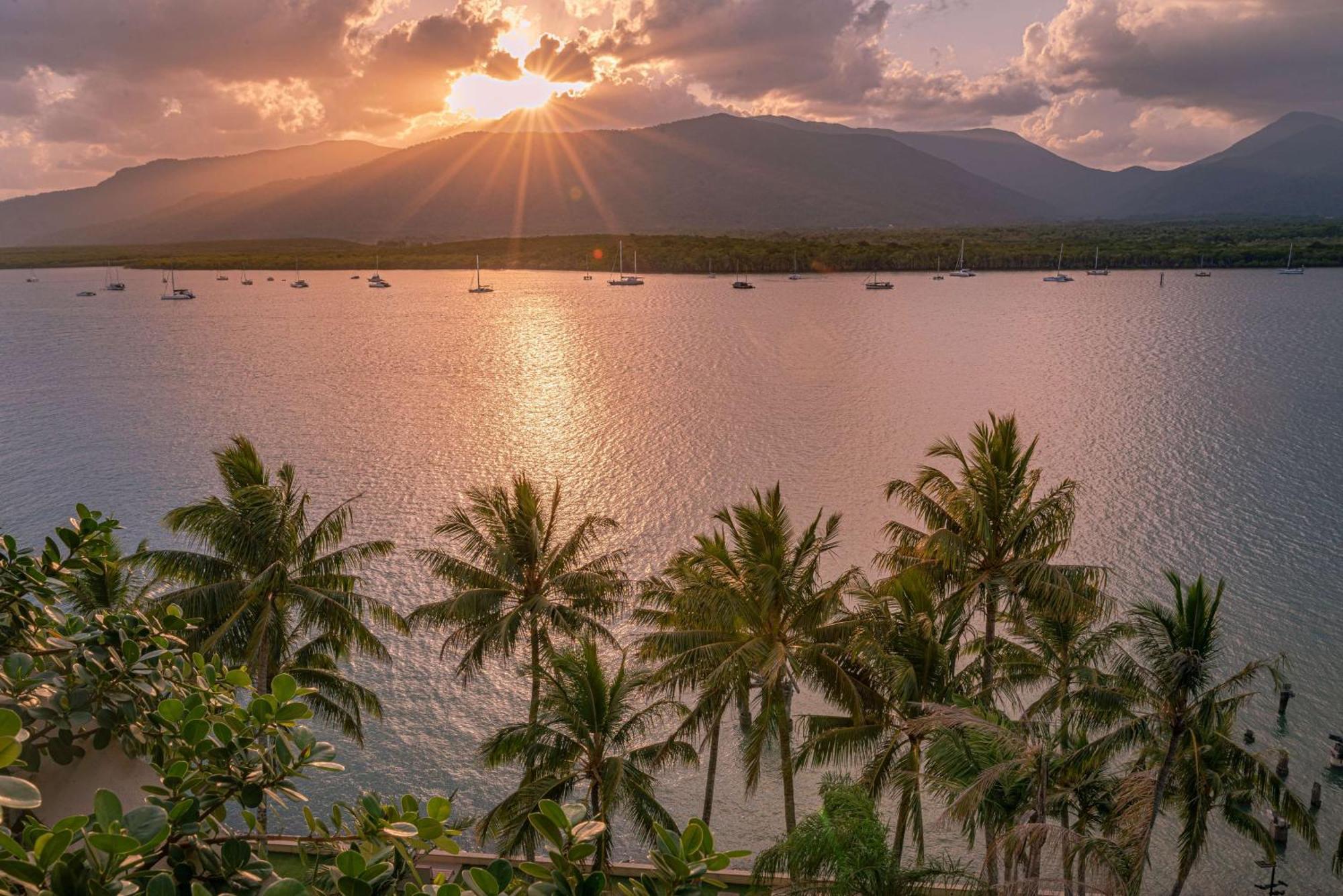 Hilton Cairns Hotel Exterior photo Sunset over the Gulf of Nicoya